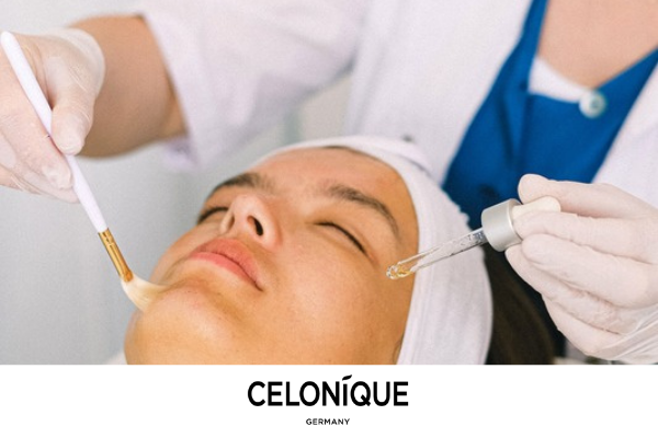 Beauty professional applying a topical skincare product to a woman's face, with CELONIQUE Germany branding.