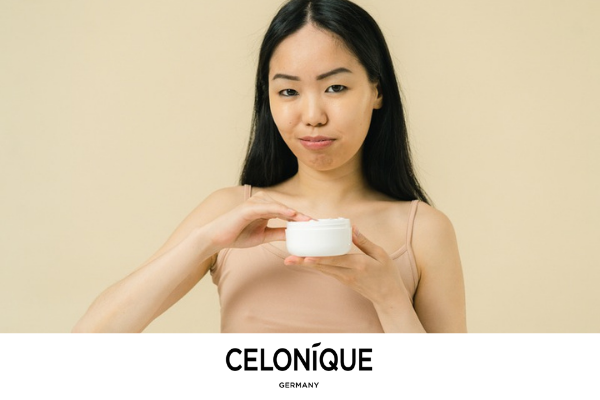 Woman holding a facial cream jar, with CELONIQUE Germany branding.